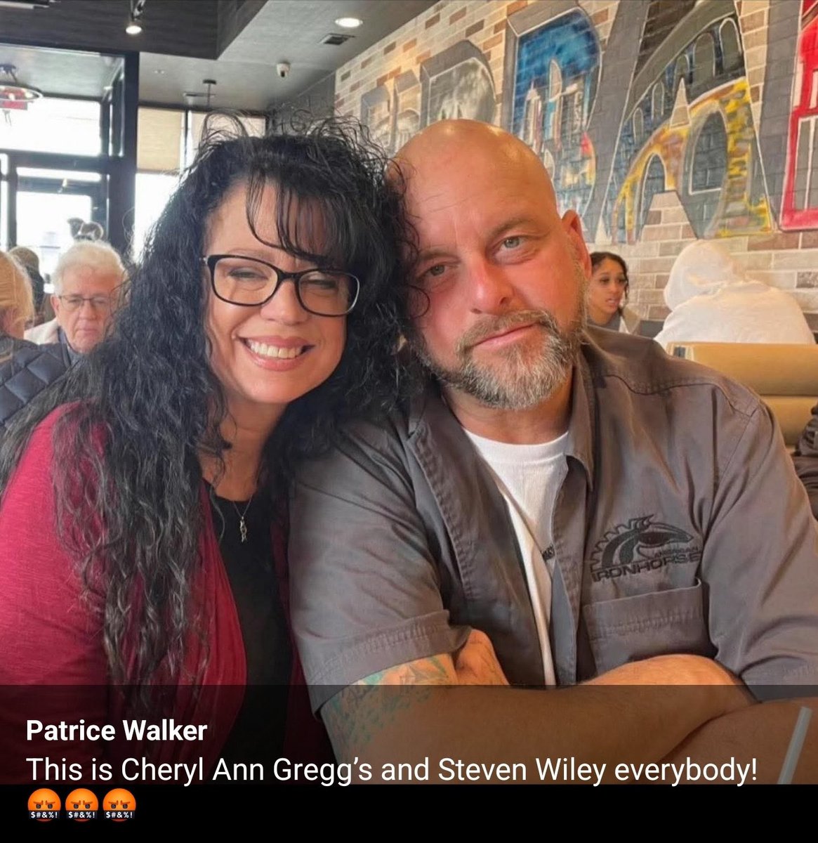 Smiling couple sitting in a restaurant.