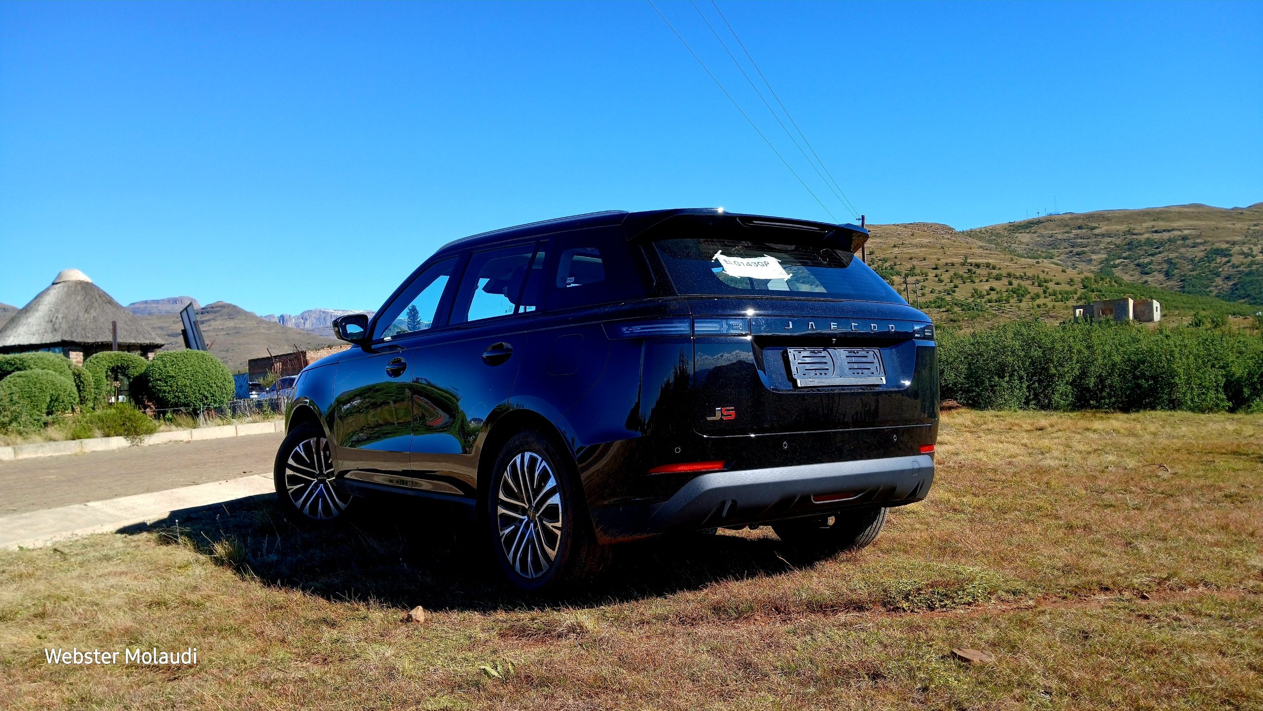 Black Jaecoo J5 SUV parked in countryside