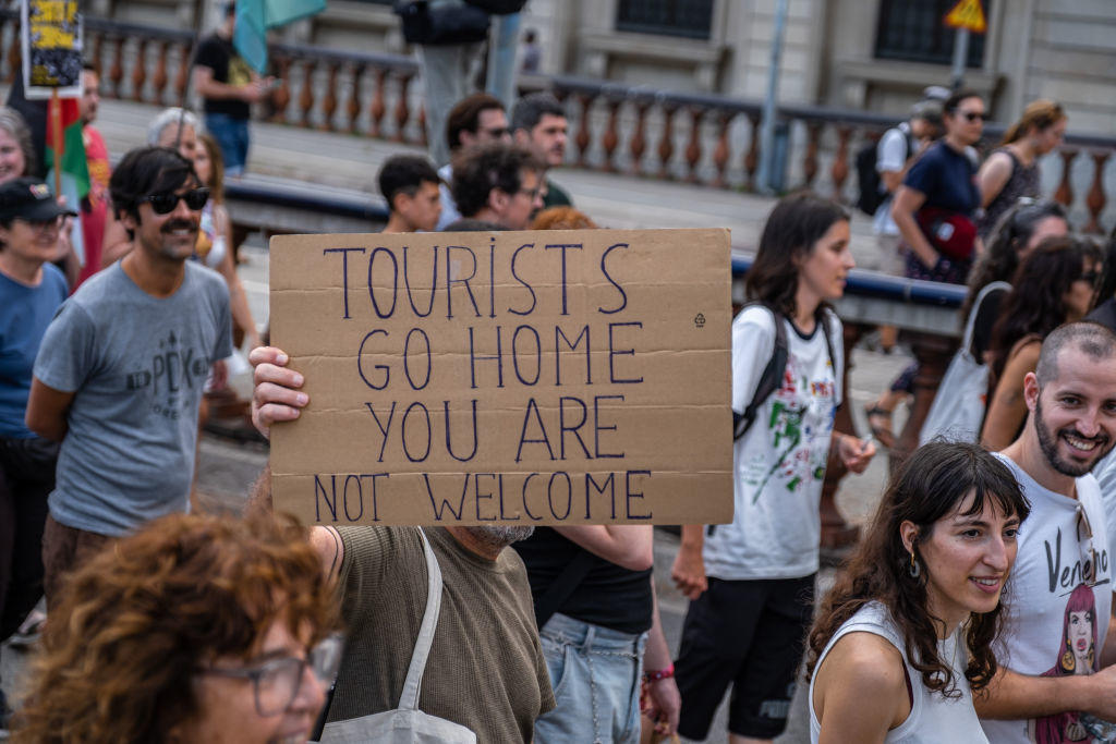 an Anti tourism Placard is Seen During the Demonstration | Virgo