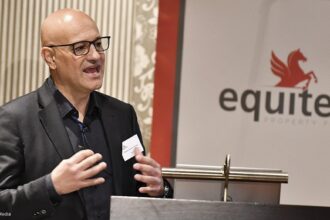 Man presenting at Equites Property Fund event