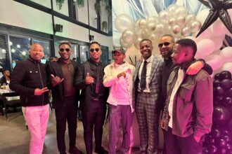 Group of men celebrating at a festive event.