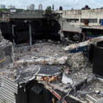 Collapsed building rubble in urban area