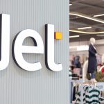 Jet store sign with mannequins inside.