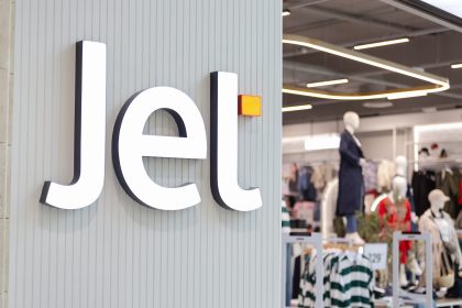 Jet store sign with mannequins inside.