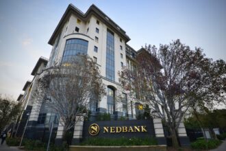 Nedbank building exterior with trees.