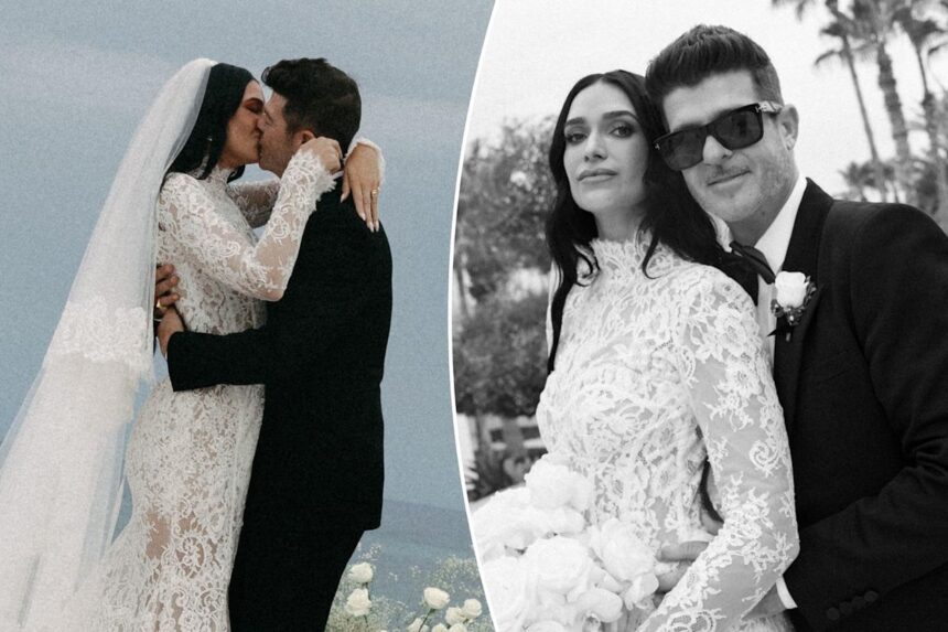 Wedding couple embracing and posing outdoors.
