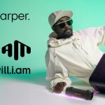 Person with speakers, Xboom by will.i.am advertisement.