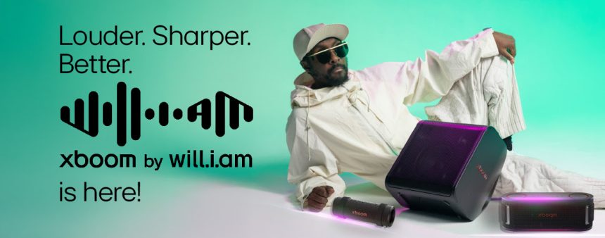 Person with speakers, Xboom by will.i.am advertisement.