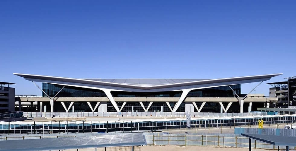 Modern airport terminal with futuristic architecture.