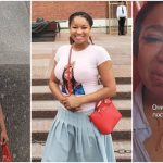 Woman posing confidently and holding passport.