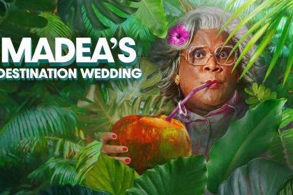 Madea sipping coconut in lush jungle setting