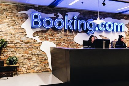 Booking.com reception area with employees working.