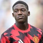 Football player in red and black Manchester United kit