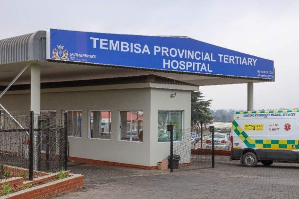 Tembisa Provincial Tertiary Hospital entrance with ambulance.