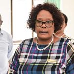 Professionals gathered in office setting, discussing important matters.