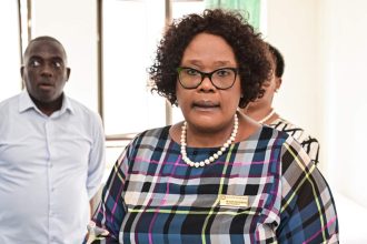 Professionals gathered in office setting, discussing important matters.