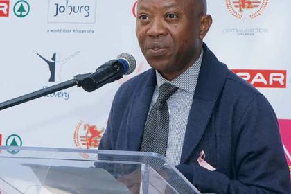 Man speaking at a Johannesburg event.