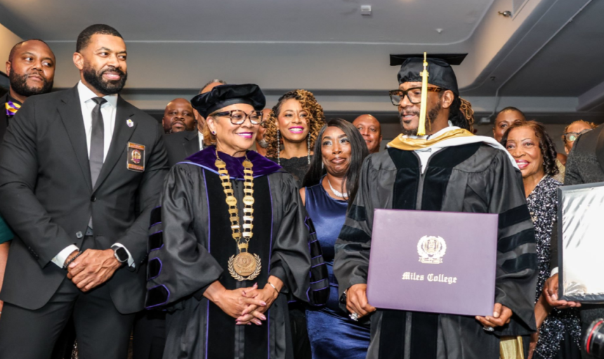 Miles College graduate receiving diploma at ceremony.