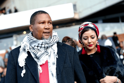 Man and woman attending an outdoor event.