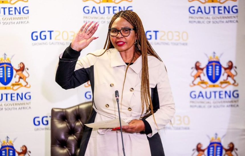 Woman speaking at Gauteng government event.