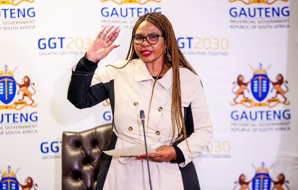 Woman speaking at Gauteng government event.
