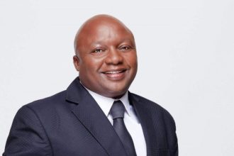 Smiling man in a suit and tie portrait.