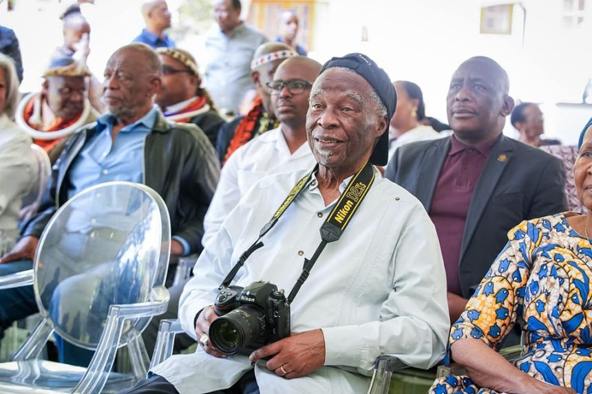 Elders seated at a cultural event.