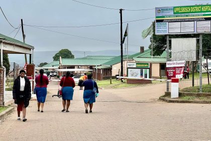 Appelsbosch District Hospital entrance with visitors walking.