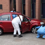 Brown Mogotsi’s red Chevrolet car after alleged staged shooting incident in Vosloorus