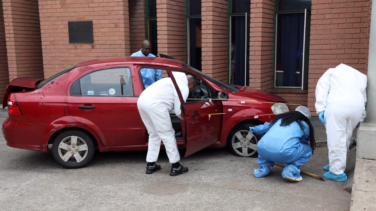 Brown Mogotsi’s red Chevrolet car after alleged staged shooting incident in Vosloorus