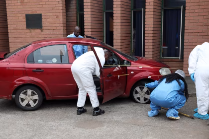 Brown Mogotsi’s red Chevrolet car after alleged staged shooting incident in Vosloorus