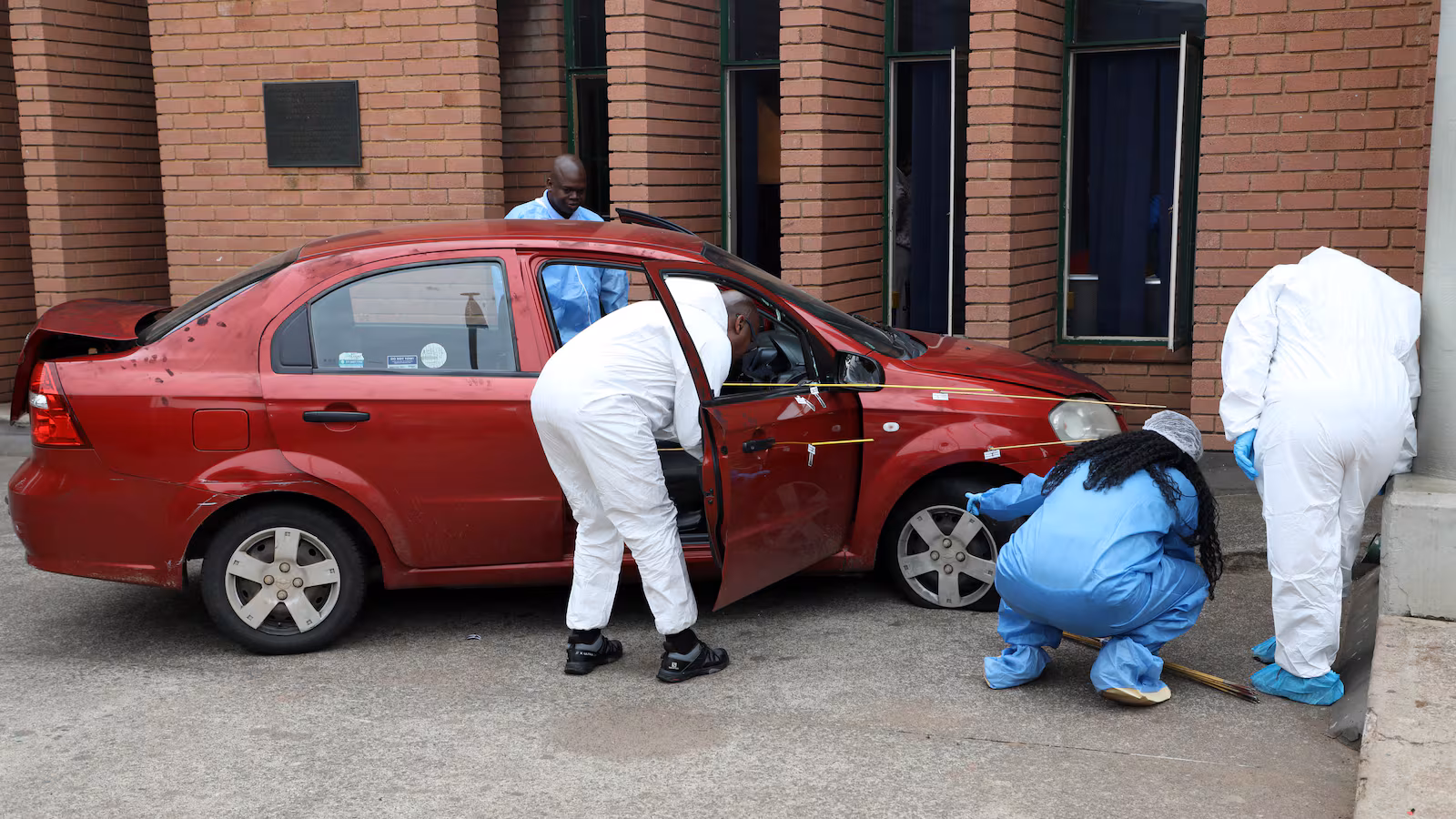 Brown Mogotsi’s red Chevrolet car after alleged staged shooting incident in Vosloorus