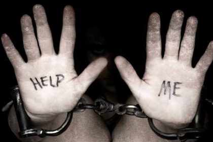 Hands in chains with 'Help Me' message.