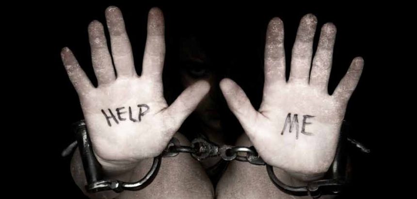 Hands in chains with 'Help Me' message.