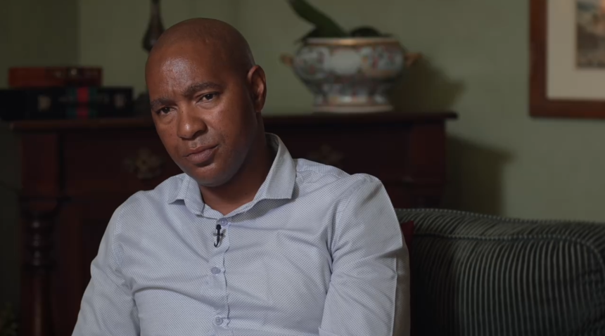 Luyanda Mboniswa sitting on a couch, looking thoughtful.