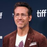 Man smiling at film festival event.