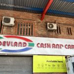 Devland Cash and Carry store signage outside building.