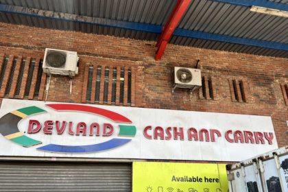 Devland Cash and Carry store signage outside building.