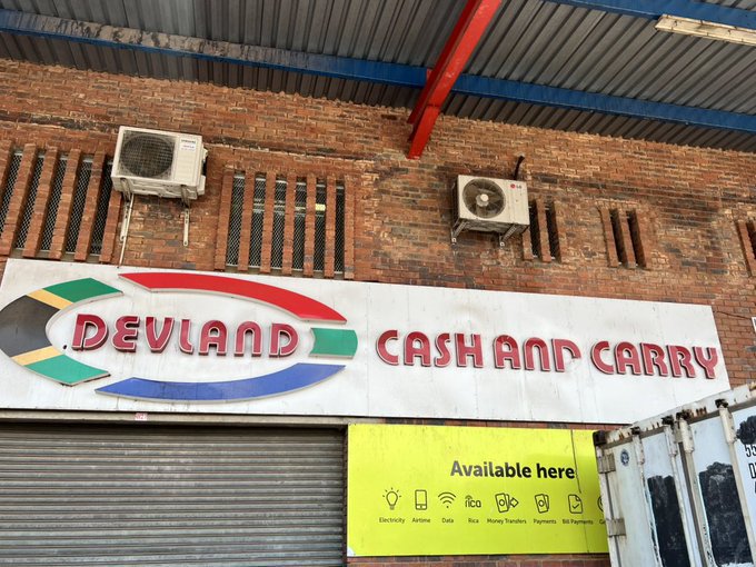 Devland Cash and Carry store signage outside building.