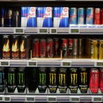 Assorted energy drinks displayed on supermarket shelves