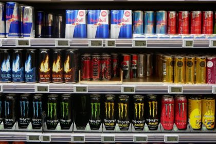 Assorted energy drinks displayed on supermarket shelves