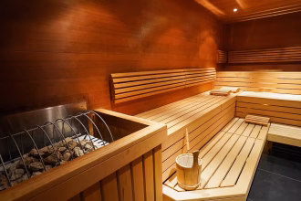 Husband and wife die after getting trapped in sauna fire 'due to faulty door handle'