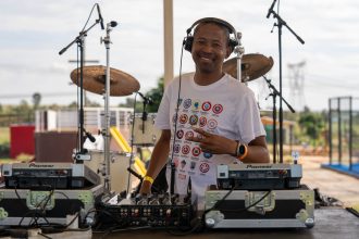 DJ Webster performing live on stage in South Africa during a house music set