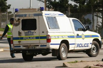 South African Police Service vehicle responding to a violent crime scene