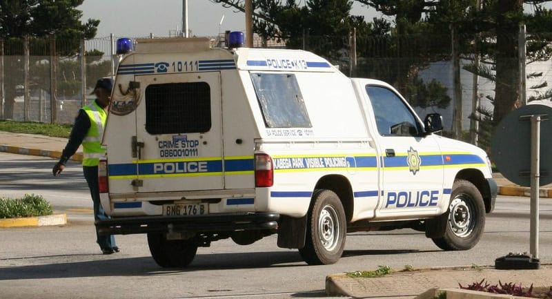 South African Police Service vehicle responding to a violent crime scene