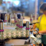 A worker checks labelling of bottles of beer at the production line of Dutch brewer Heineken factory on June 7, 2011 in Schiltigheim, eastern France, during an official visit announcing the group's goals for sustainable development, by reducing the amount of glass in some beer bottles' production, and lowering by 20 percent the energy needed at its Alsacian factory. [Photo by PATRICK HERTZOG/AFP via Getty Images]