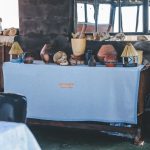 Rustic lodge display with traditional pottery and crafts