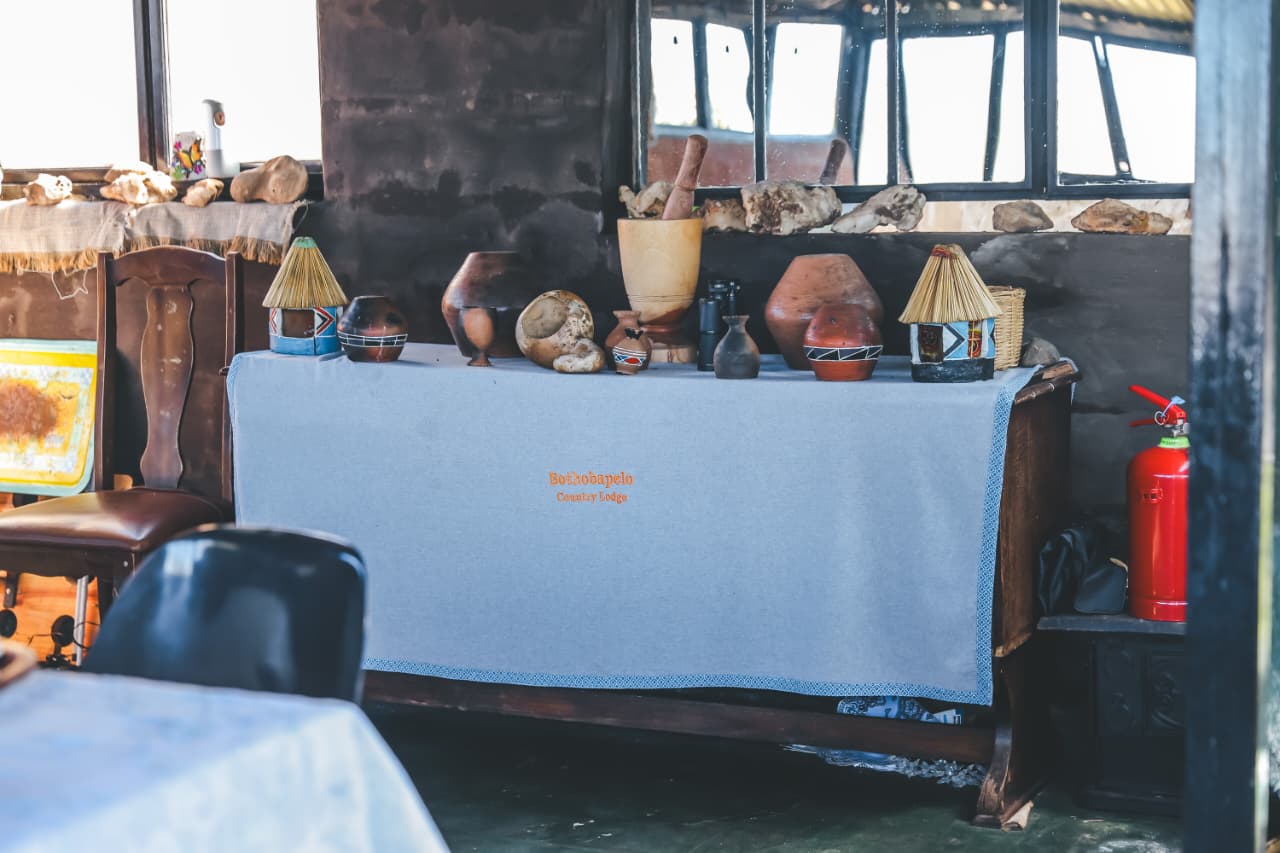 Rustic lodge display with traditional pottery and crafts