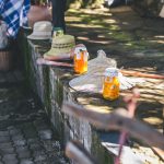 Jars of preserves and straw hats outdoors