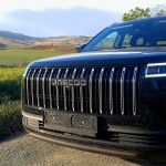 Black Jaecoo SUV parked on rural road